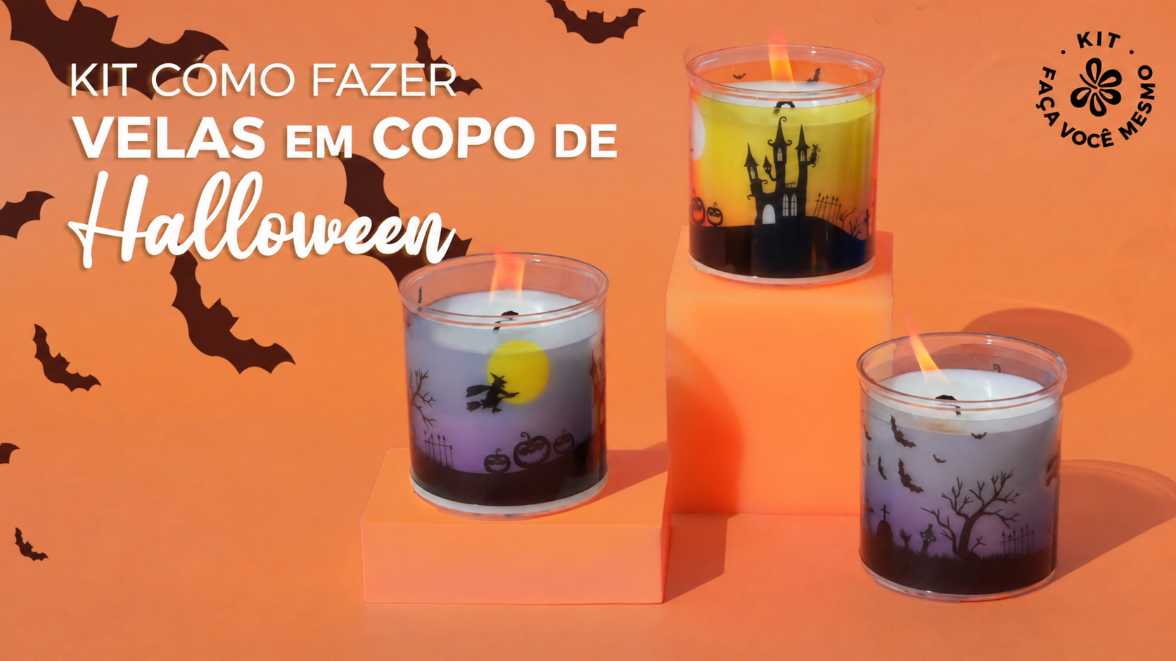Três velas de Halloween em copo decoradas com castelo, bruxa e morcegos